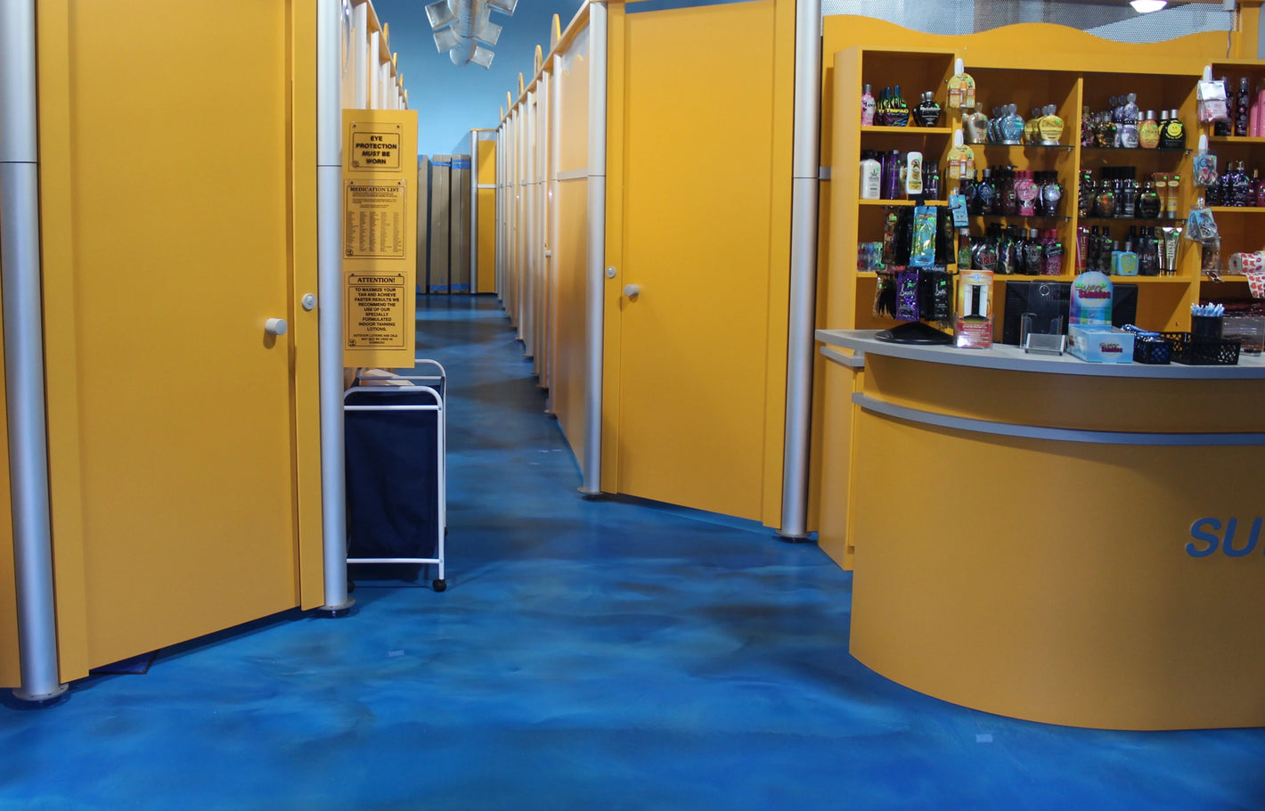 A metallic epoxy floor made to look like water installed in a tanning salon on Staten Island New York